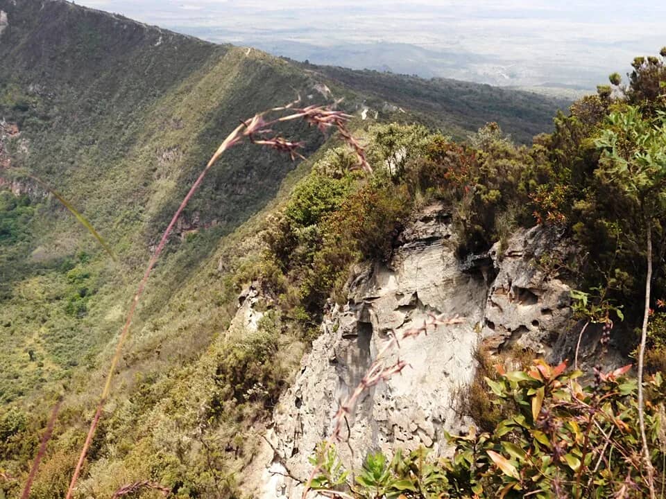 The narrow crater rim path on Mount Longonot dropping away on both sides