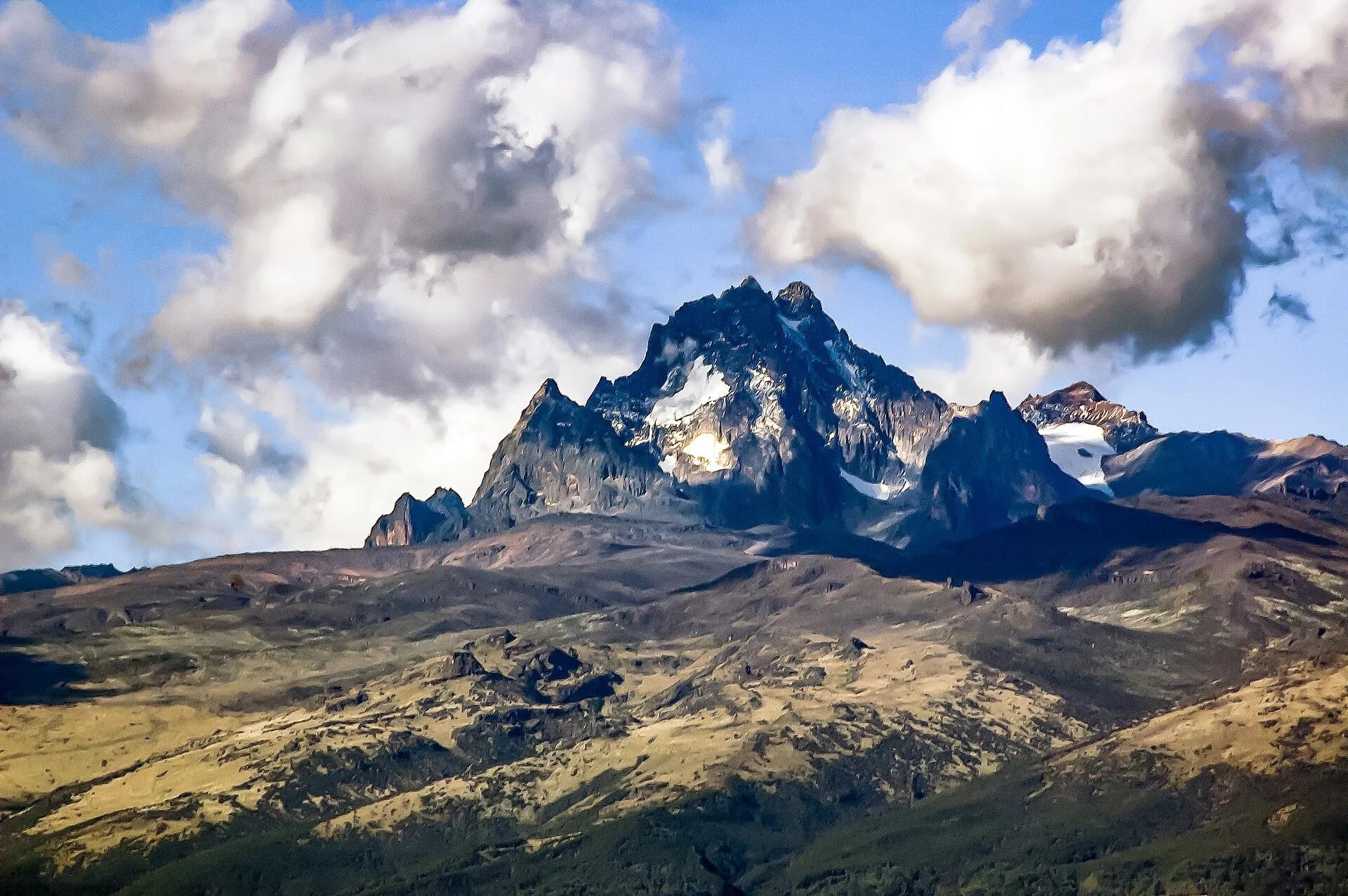 The jagged peaks of Mount Kenya rising above the clouds